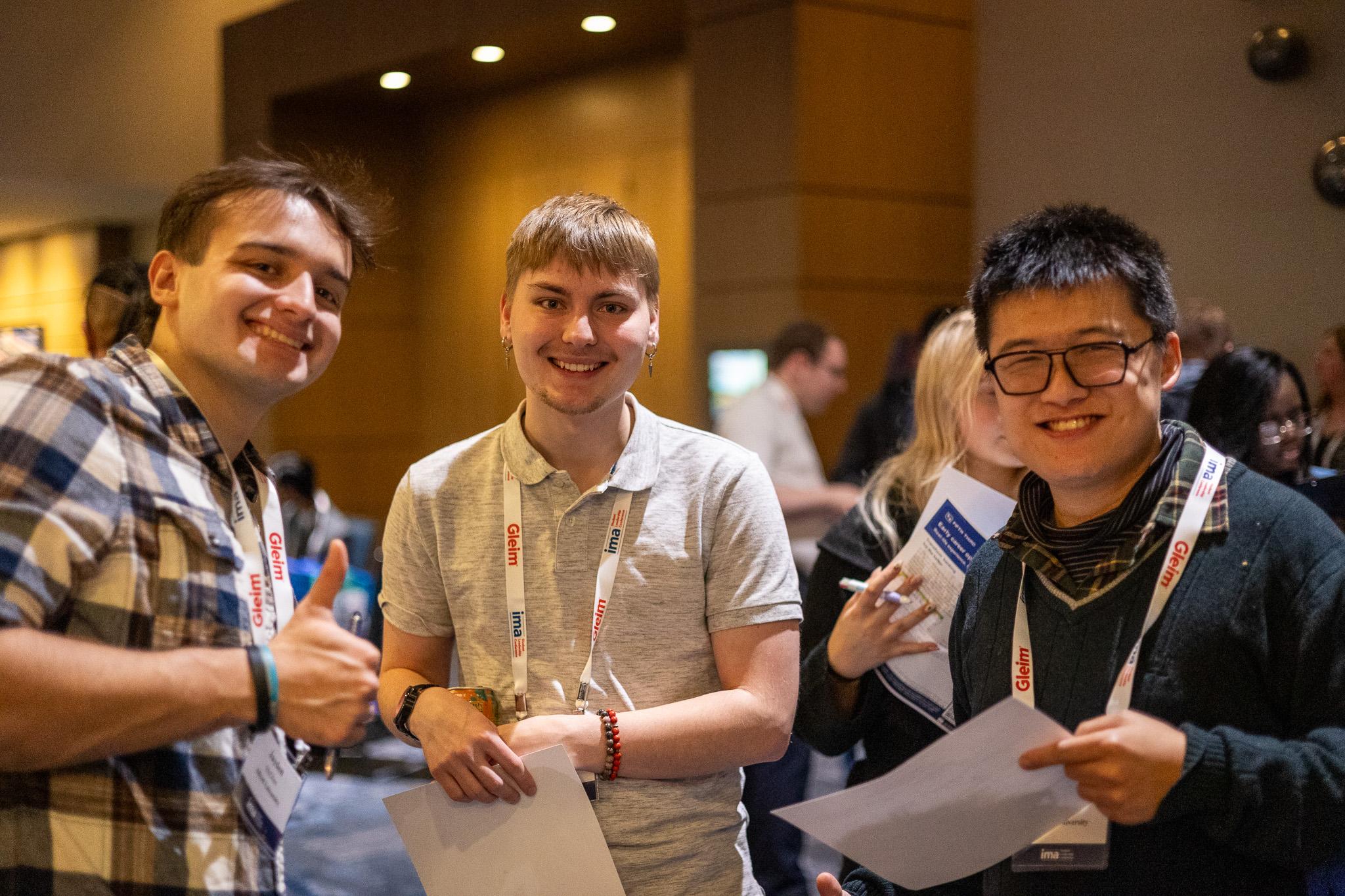 Three students at conference