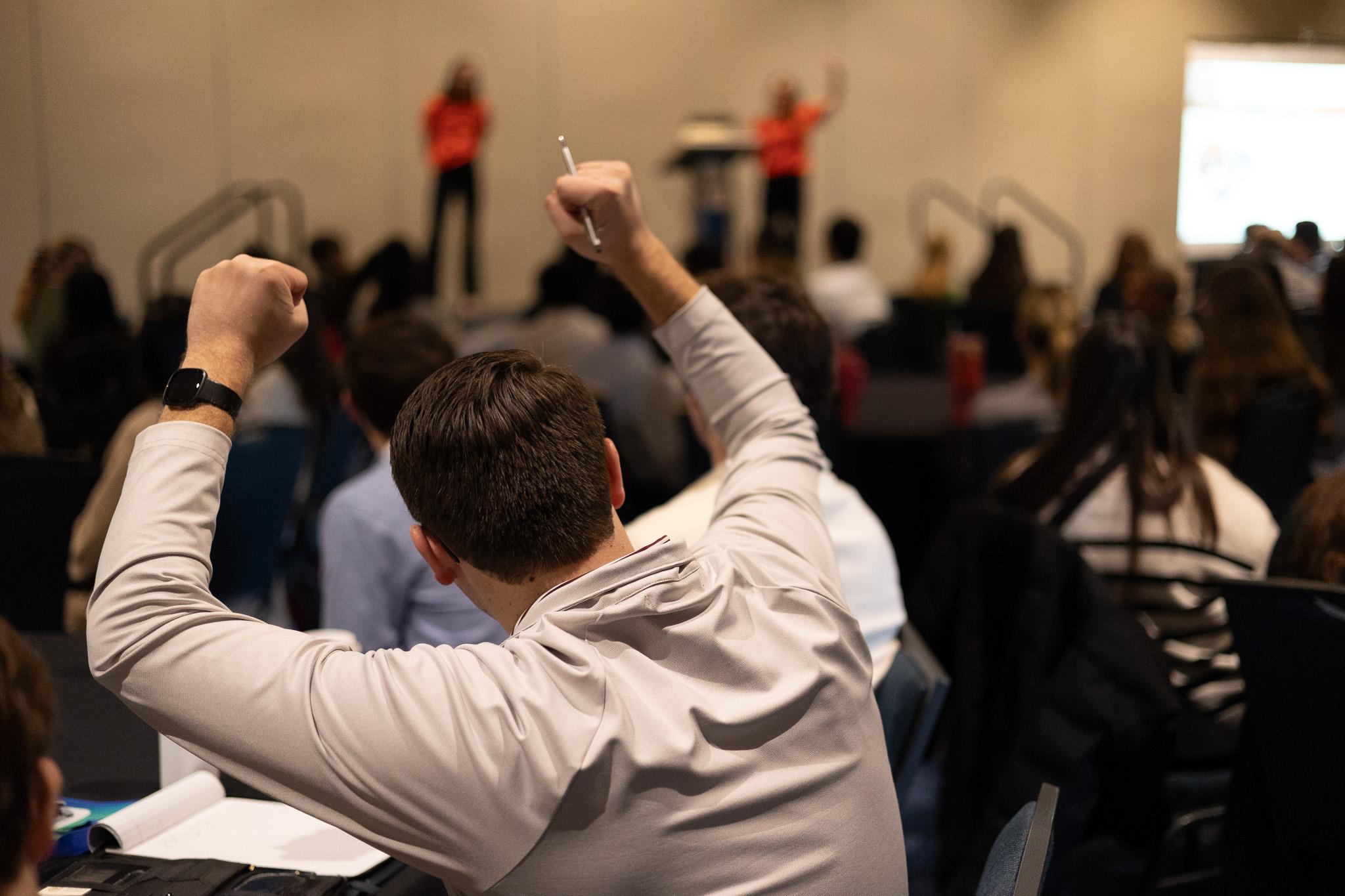 Image of student in a crowd while cheering